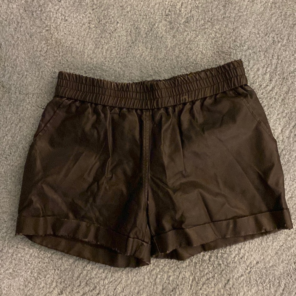 Black leather shorts.